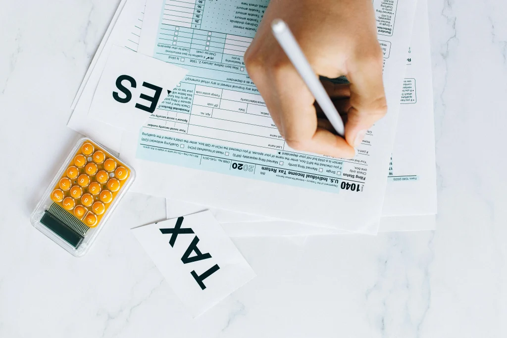 Person filling out tax forms